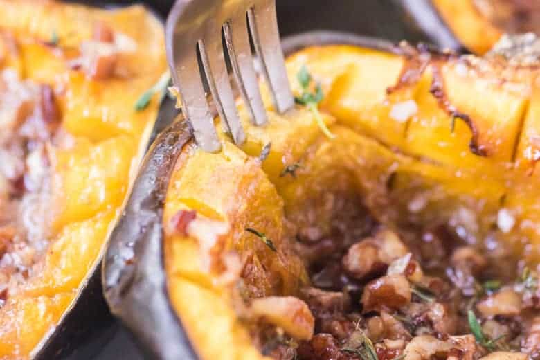 fork digging into acorn squash