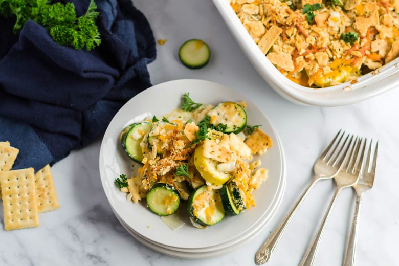 Cheesy squash casserole on a serving plate 