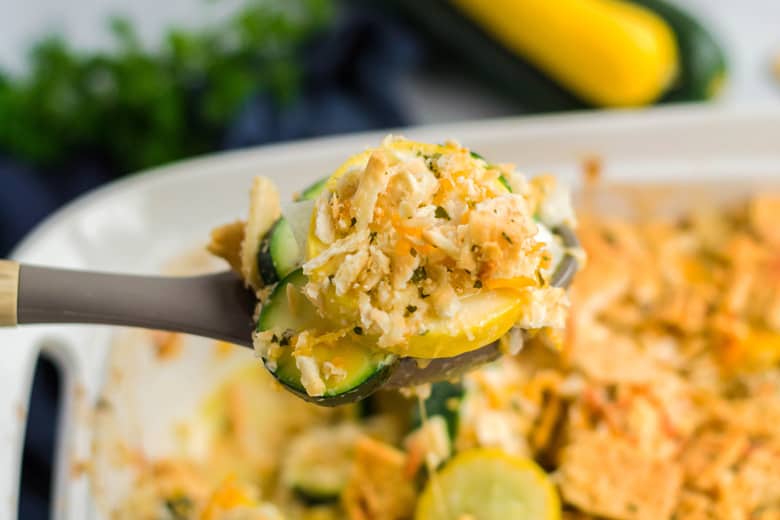 spoon of cheesy squash casserole