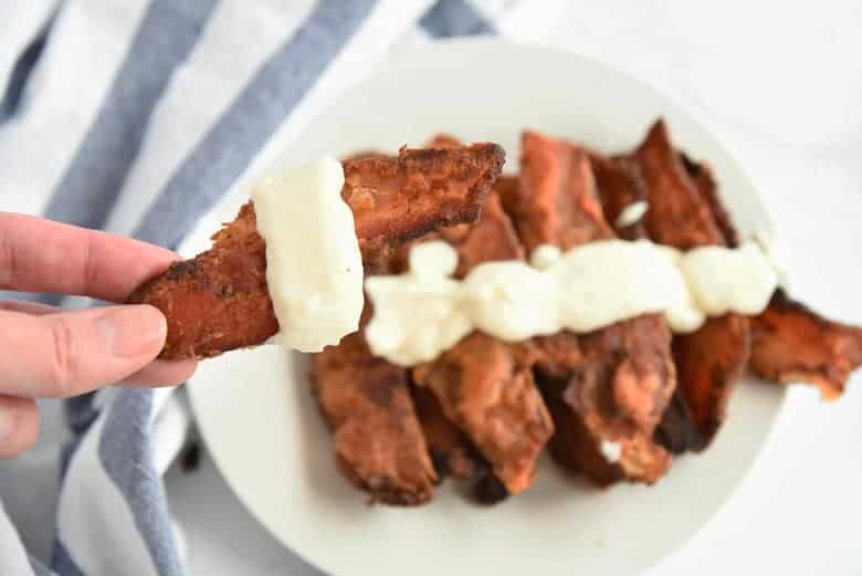 Close up of chicken fried bacon with gravy 