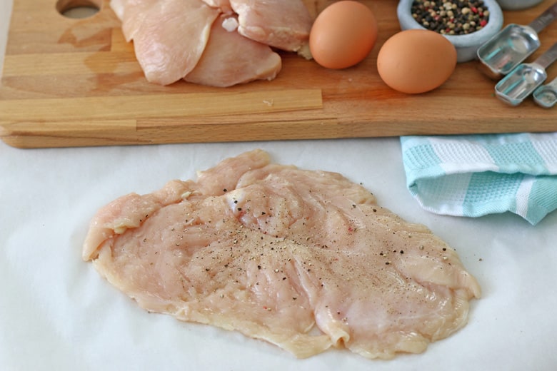 Pounded chicken breast seasoned with salt and pepper 