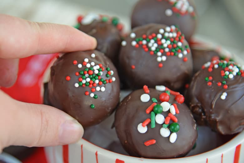 hand reaching in for oreo cookie ball 