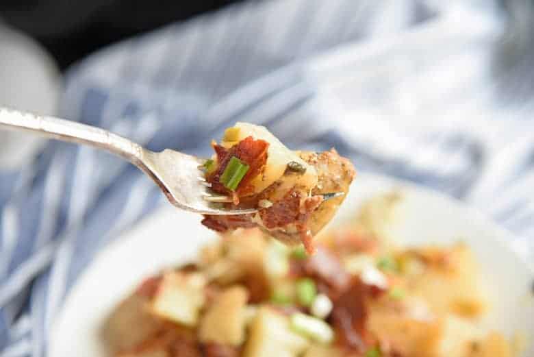 Cheesy potatoes on a fork 