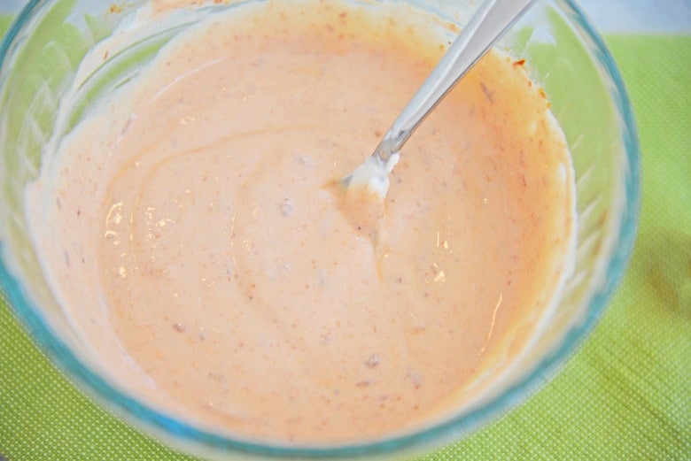 Sriracha Sour Cream in a mixing bowl 