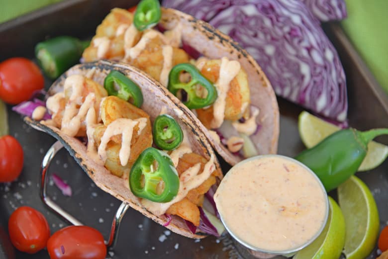 Sweet and spicy shrimp tacos with zesty sour cream 