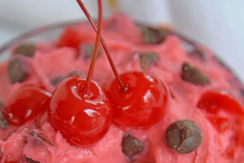 Two cherries on top of edible cookie dough 