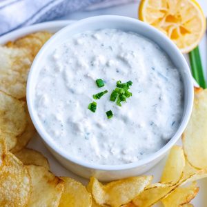 bowl of clam dip with potato chips