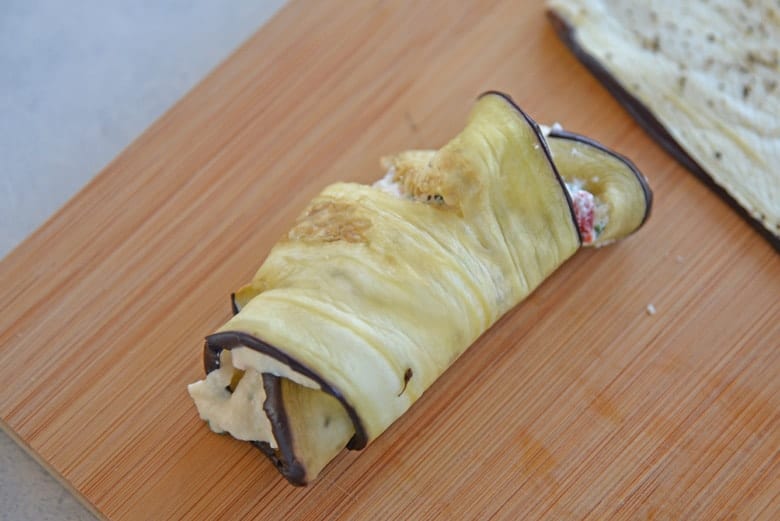 Stuffed Eggplant Rollatini on a cutting board