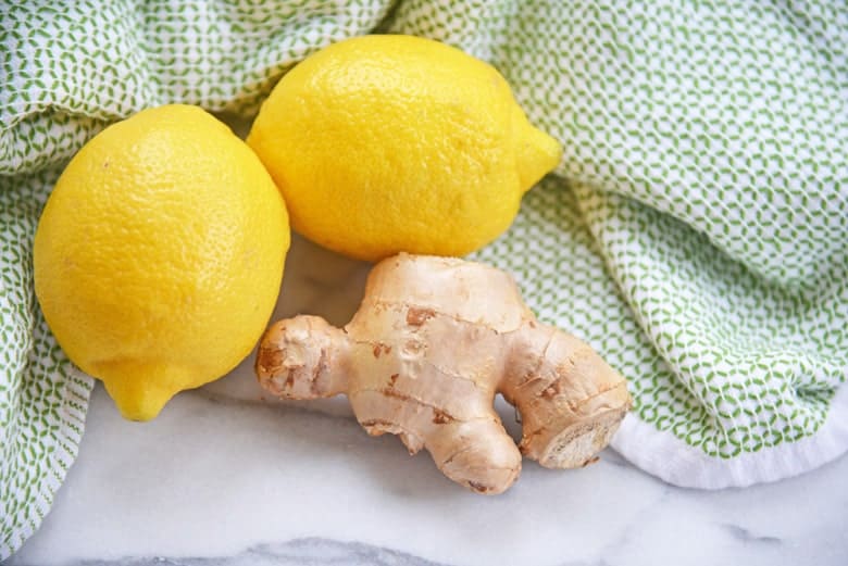 Lemons and ginger on a green linen