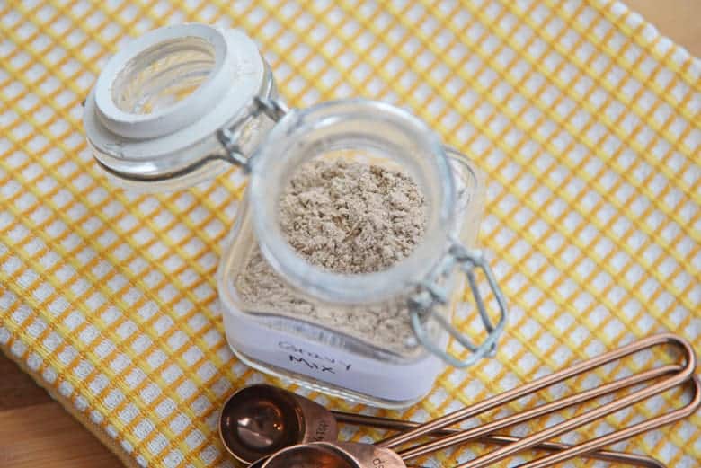 Homemade gravy mix in a glass storage container 