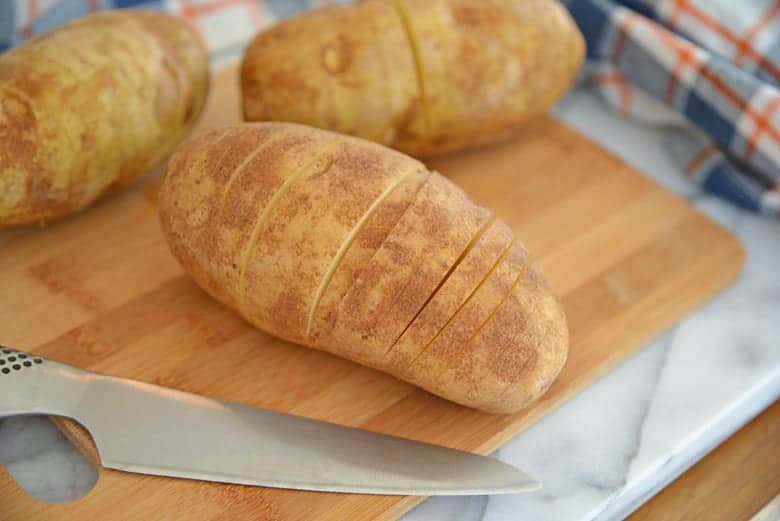 Thinly cut potatoes for Hasselback potatoes 