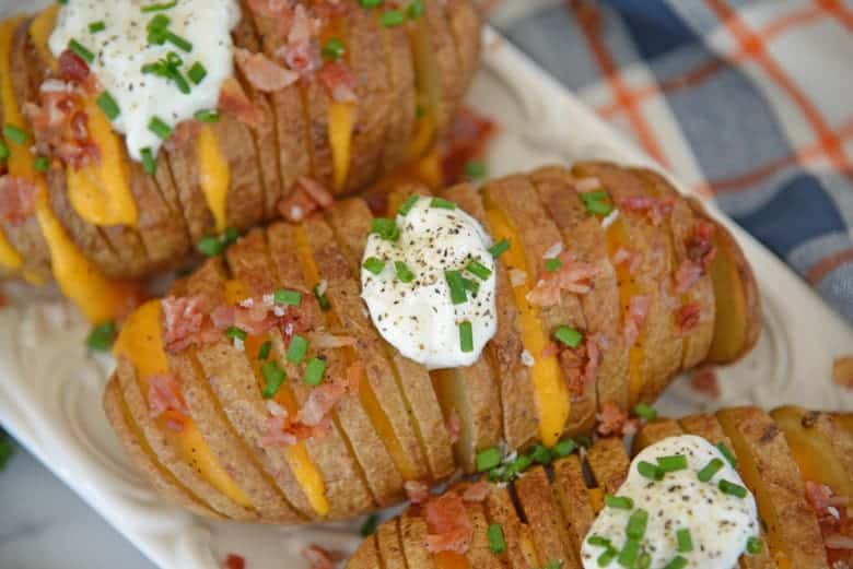 overhead shot of baked and loaded hasselback potatoes 