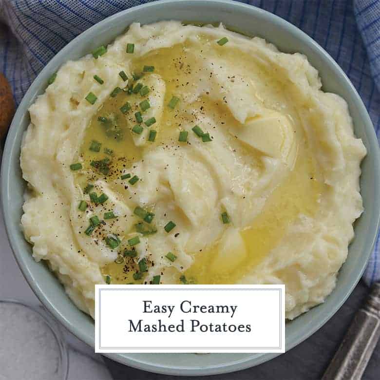 Overhead creamy mashed potatoes with butter, salt, pepper and chives 