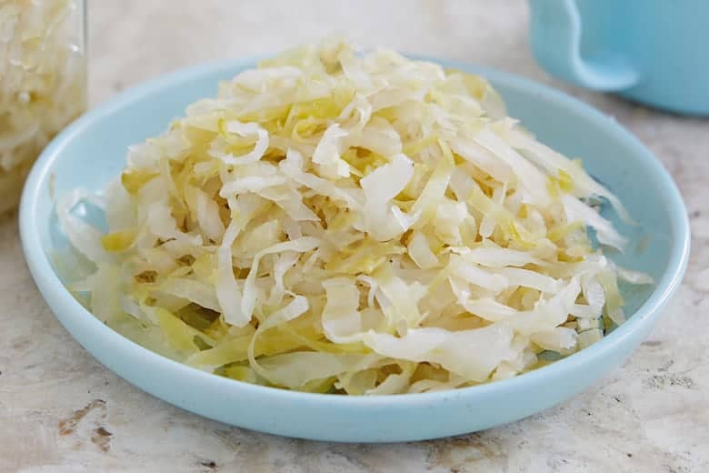 Homemade sauerkraut on a little blue plate 