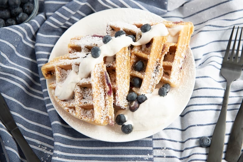 Sliced blueberry waffles on a plate 