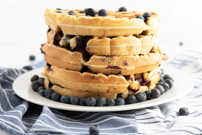 Stack of fluffy blueberry waffles  