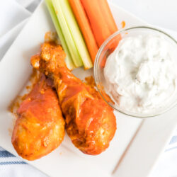 white plate with buffalo chicken wings