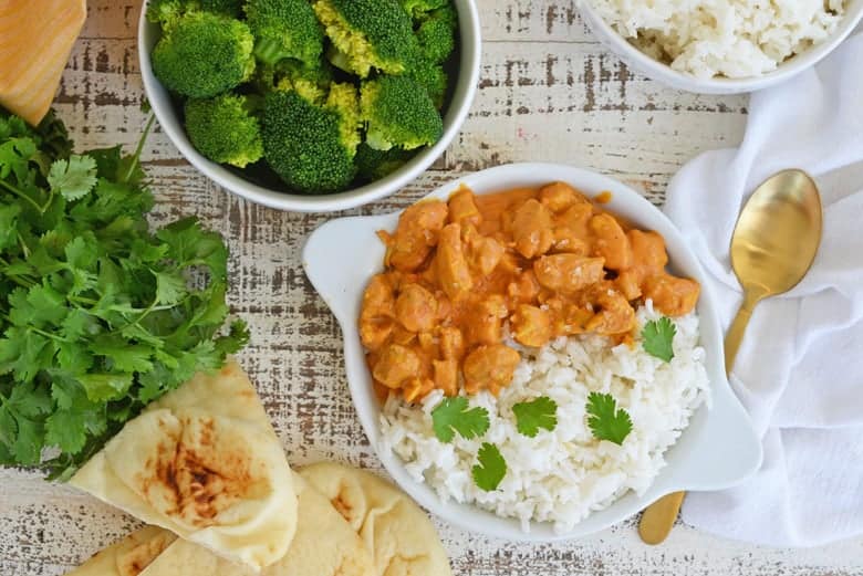 Overhead image of butter chicken with broccoli 