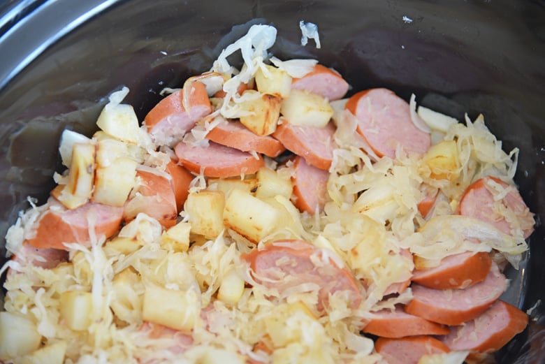 Close up of sauerkraut and sausage