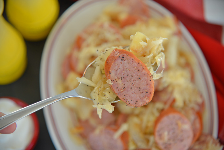 Spoon of kielbasa with sauerkraut 