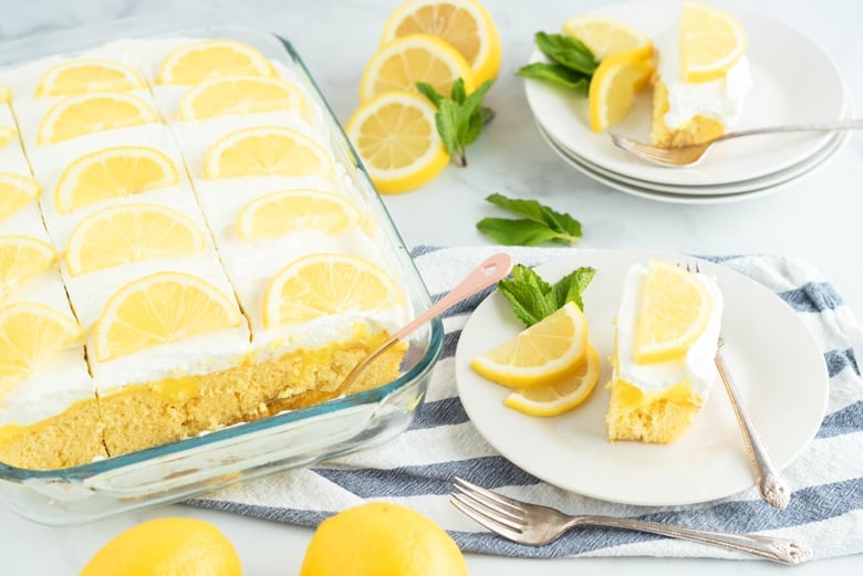 Serving lemon poke cake with mint leaves 