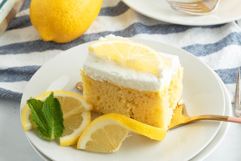 A slice of cake on a plate, with Lemon