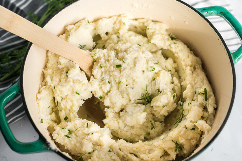 creamy homemade mashed potatoes in a dutch oven 