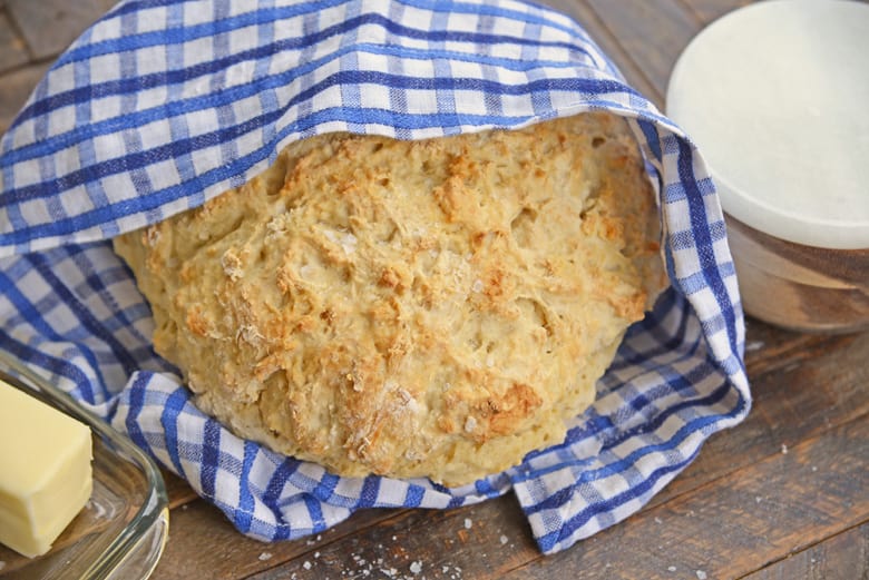 loaf of 2-ingredient bread in a blue napkin 