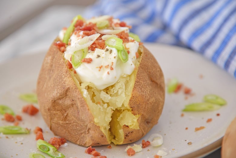 Loaded baked potato from the side 