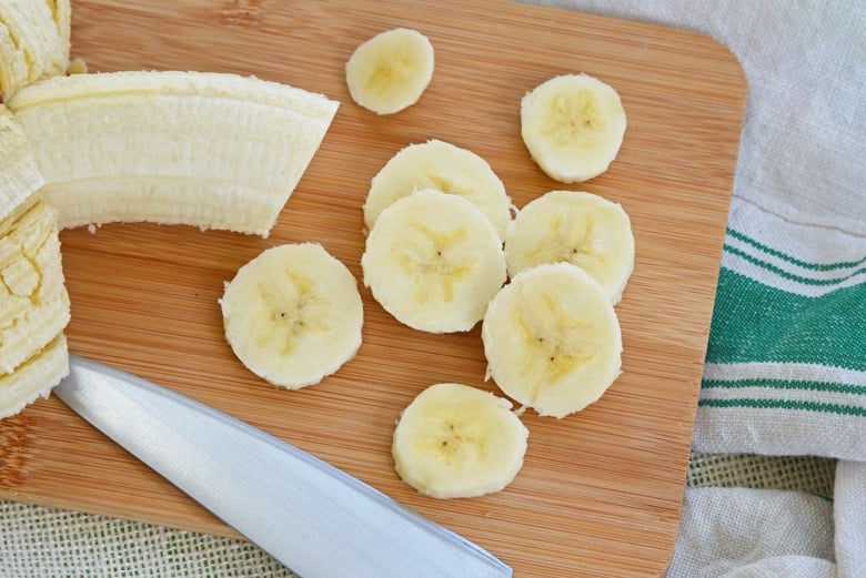 sliced bananas on a cutting board  