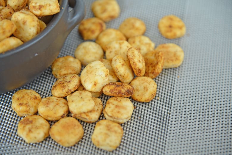 close up of cajun oyster cracker spilled on napkin