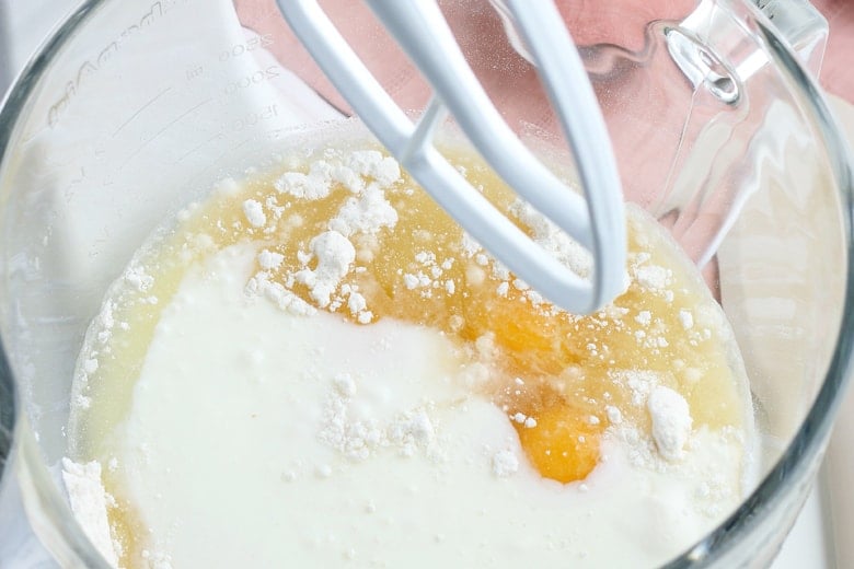 Ingredients for Cherry Poke Cake in a mixing bowl 