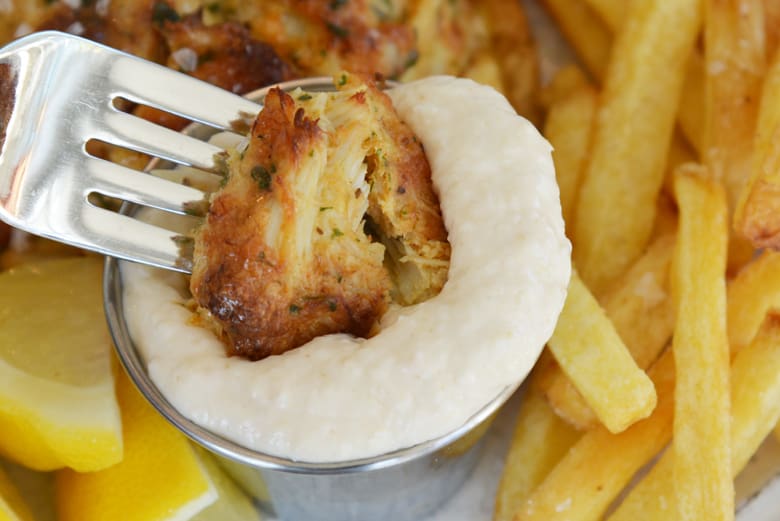 lump crab meat dipping into horseradish sauce 