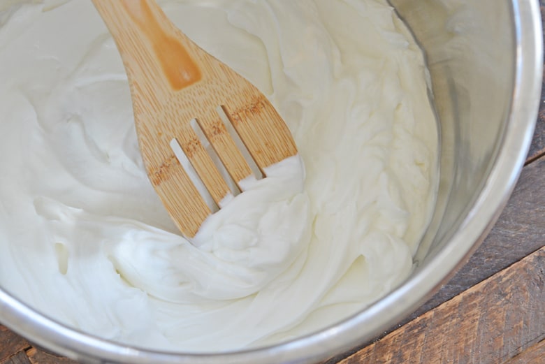 yogurt in an instant pot with wooden spoon