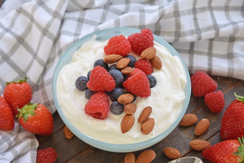 bowl of yogurt with fruit and nuts