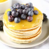 stack of pancakes with lemon curd and blueberries