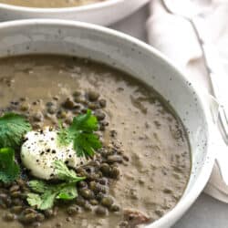 close up of bowl of lentil broth soup