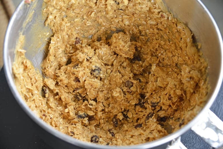 Oatmeal raisin cookie dough in a mixing bowl 