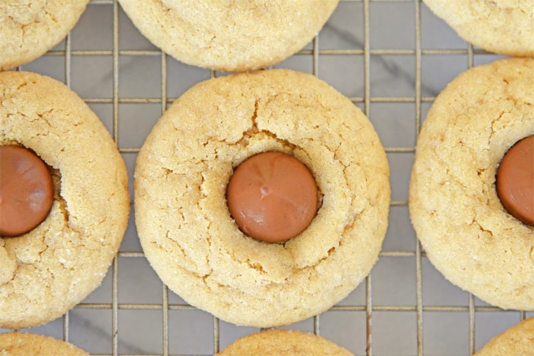 peanut butter blossom cookie on a cooling rack 