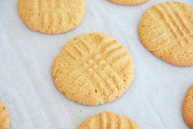 soft peanut butter cookies on a baking sheet with parchment paper 