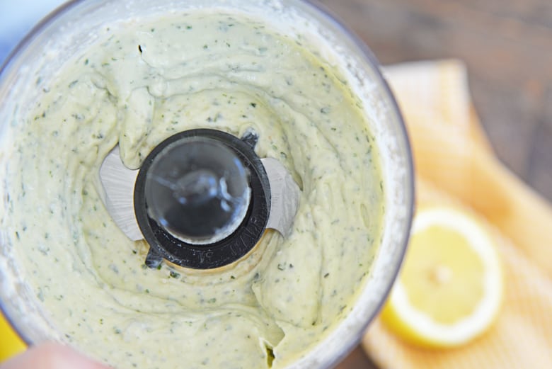 close up of pesto aioli with fresh basil 