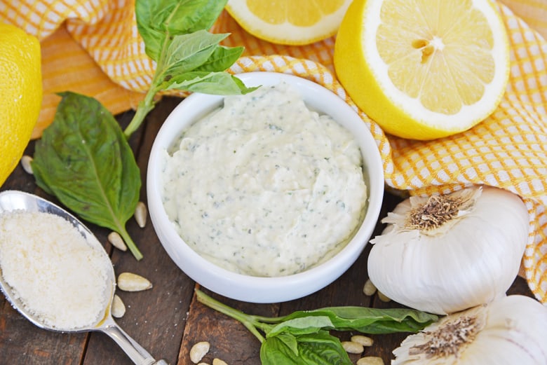 fresh basil pesto aioli in a white dipping bowl 