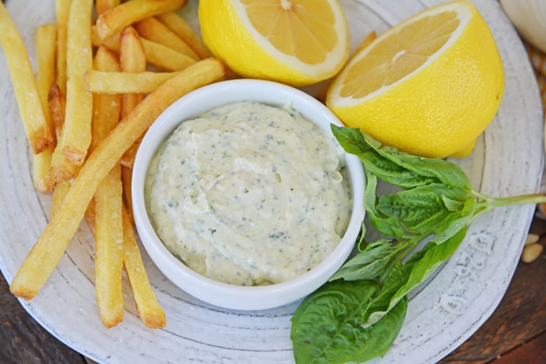 basil aioli served with french fries and  fresh basil and lemon  