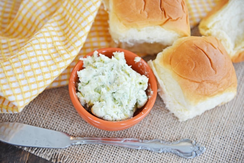 Homemade butter with ranch seasonings in a burnt orange bowl 