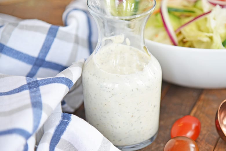 close up of salad dressings in a glass jar