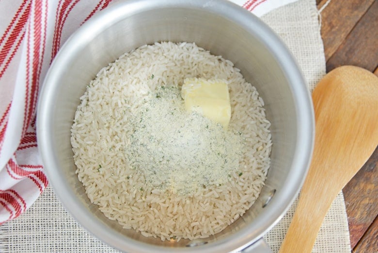 dry rice, butter and ranch mix in a saucepan 