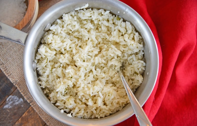 This EASY Ranch Rice recipe is a super versatile side dish that will add gentle flavor to any dinner you are serving. A great way to use a pantry staple! #ranchrice #ricerecipes #ranchricerecipe #easyricerecipes www.savoryexperiments.com