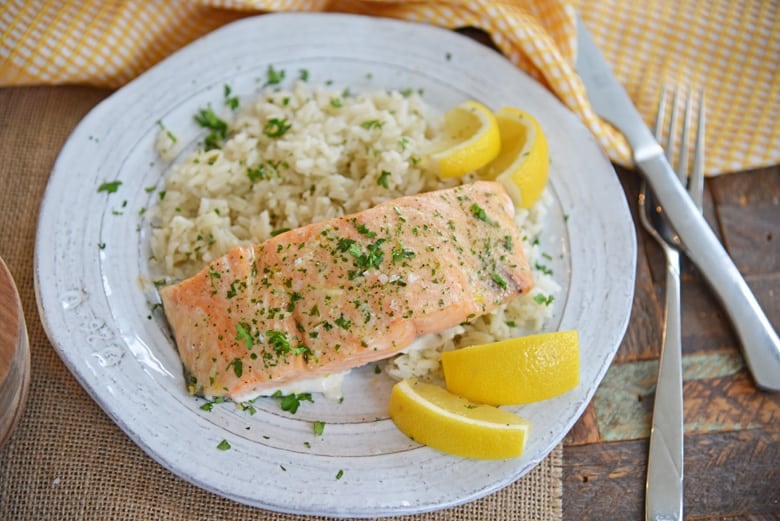 Ranch salmon with rice and fresh lemon wedges  