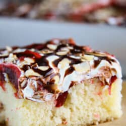 slice of raspberry cream poke cake