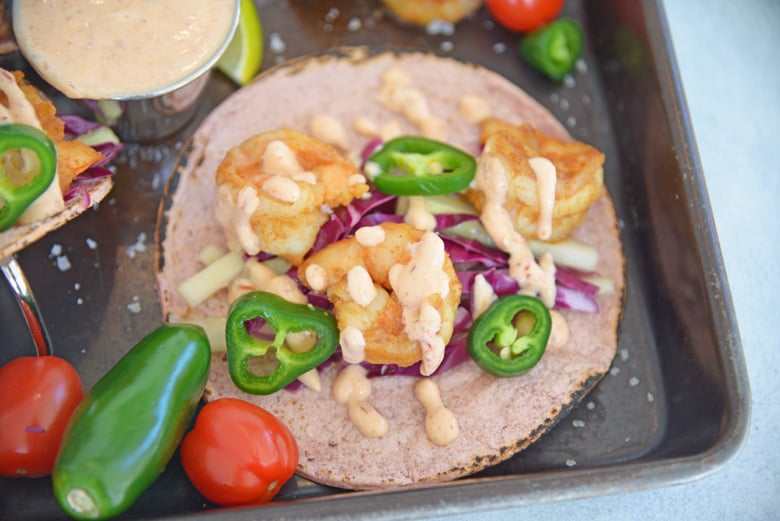 Shrimp tacos with slaw, jalapeno and sour cream